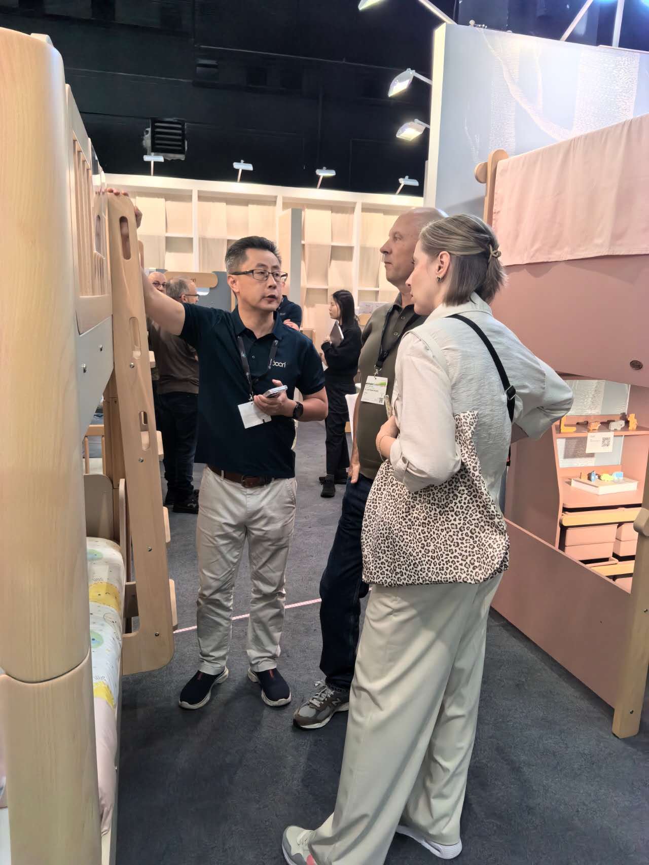 Boori team explaining wooden bunk bed to buyers at Kind Jugend 2026 Cologne booth Boori team explaining wooden bunk bed to buyers at Kind Jugend 2026 Cologne booth